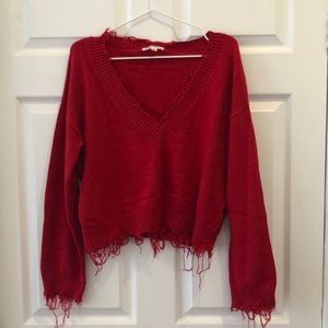 Red distressed sweater
